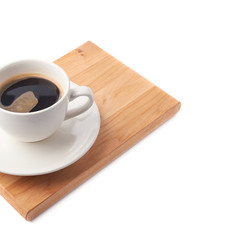 Fresh cup of coffee on a serving board