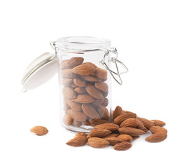 Glass jar filled with almonds isolated