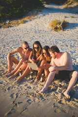 group of young multiethnic friends beach summer