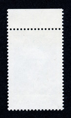 Reverse side of a postage stamp.