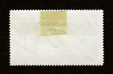 Reverse side of a postage stamp.