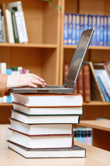 Woman hands in a library