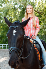 Upbeat girl riding the horse 