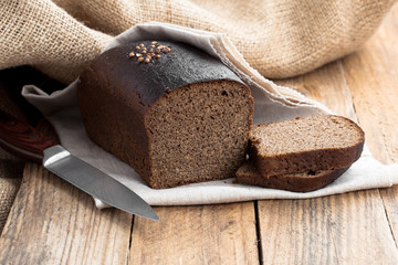 Bread rye on an old wooden background