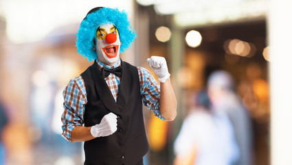 portrait of a clown smiling over white background