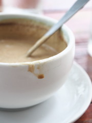 Coffee stain on white cup.