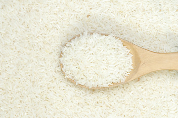 Spoon of jasmine rice background.