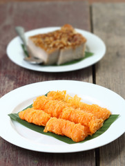 Thai dessert, coconut custard squares and golden threads.