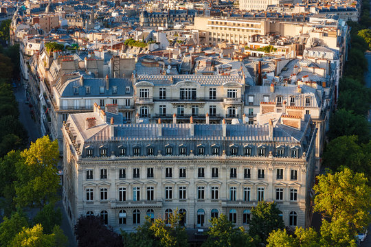 Haussmanian building with curvilinear facade and Paris Rooftops, France