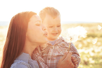 Mother with her child in sunlight