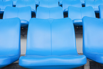 Obraz premium Empty blue seats or chair rows in stadium