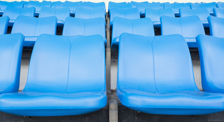 Obraz premium Empty blue seats or chair rows in stadium