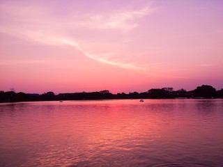 Fototapeta na wymiar Pink Light Lake View Landscape on the Sunset