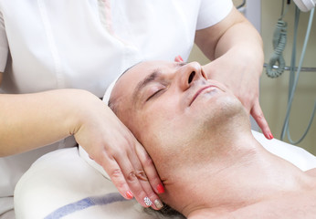man in a beauty salon facial and massage