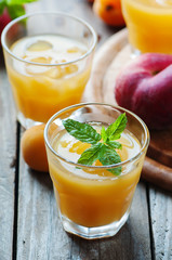 Sweet fresh peach juice with ice