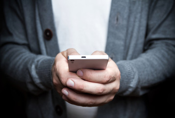 The man with the phone in his hand. Photography in low key