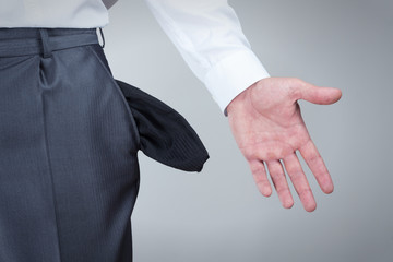 Businessman showing empty pockets