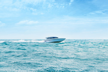 Big and luxury speedboat moving in the sea. Motor vessel. © Acronym
