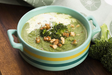 Broccoli cream soup on table