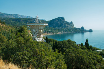 Landscape with mountain, sea and radio telescope