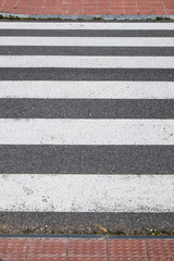 a pedestrian crossing in a city street cradle
