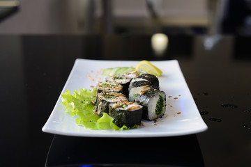 Japanese sushi on a white plate.
