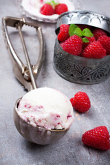 Ice cream scoop with berry ice cream and raspberry