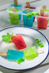 Homemade ice cream with fruits and mint leaf