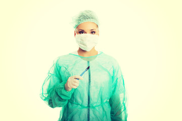 Portrait of female doctor with a scalpel