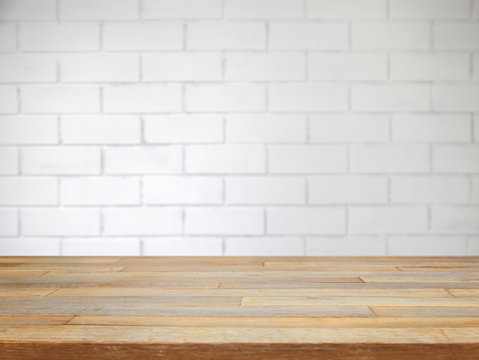 Fototapeta Empty table and white brick wall background, product display template