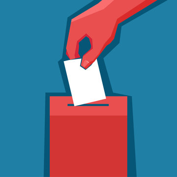 Hand puts ballot in the ballot box