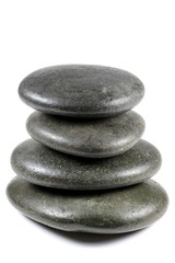 Basaltsteine für Warmsteinmassage isoliert auf weißem Hintergrund
