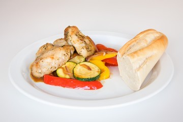 Grilled chicken wings and vegetable with french baguette