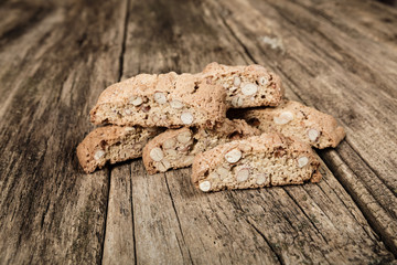 Fototapeta premium Heap of biscotti biscuits on a wooden table