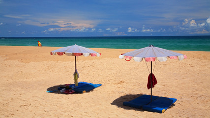 Parasols on sand at Karon beach in Phuket