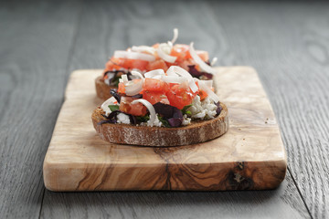 homemade bruschetta with ricotta tomatoes and herbs