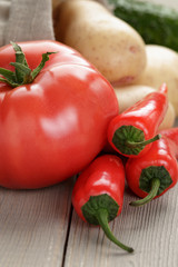 freshly harvested organic vegetables on wooden table