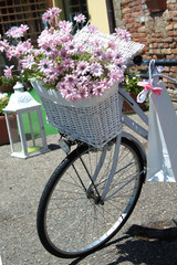 Fototapeta na wymiar White bike classical with floral decorations
