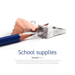 School supplies. Metal sharpener and blue crayon.