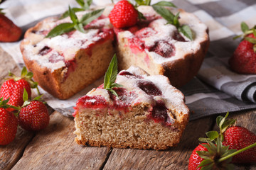 sliced strawberry pie on a table close-up. Horizontal rustic