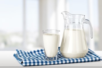 Milk, glass, tablecloth.