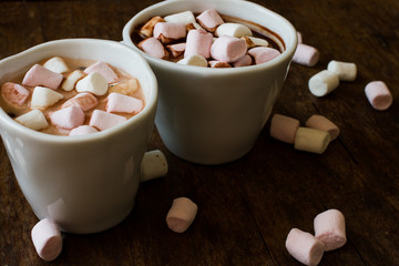 Belgian chocolate in a white bowl on a wooden table