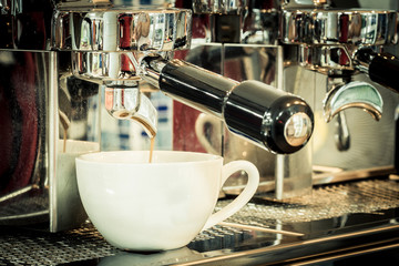 prepares espresso in coffee shop