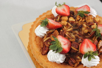  nut pie ontop cream  and  fresh strawberry