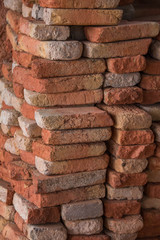 Close view of a pile of traditional mud bricks production.