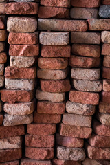 Close view of a pile of traditional mud bricks production.
