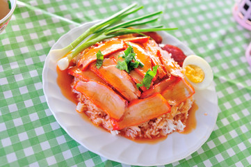 thai food is name rice red pork sauce