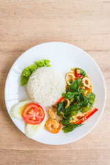 Spicy fried basil leaf with seafood and rice