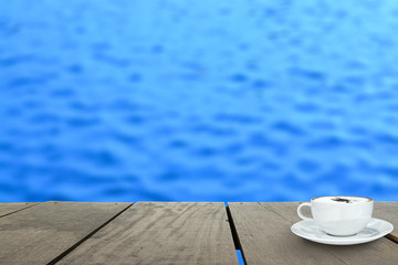 veranda wood and coffee inside river (Blur background)