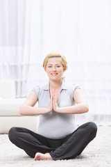 Pregnant woman practicing yoga